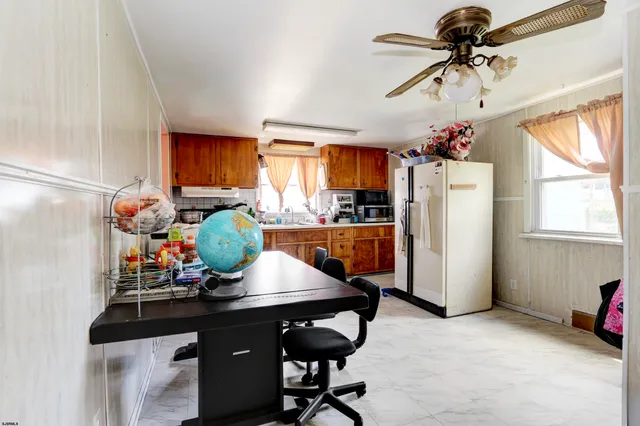 a room with furniture a window and appliances