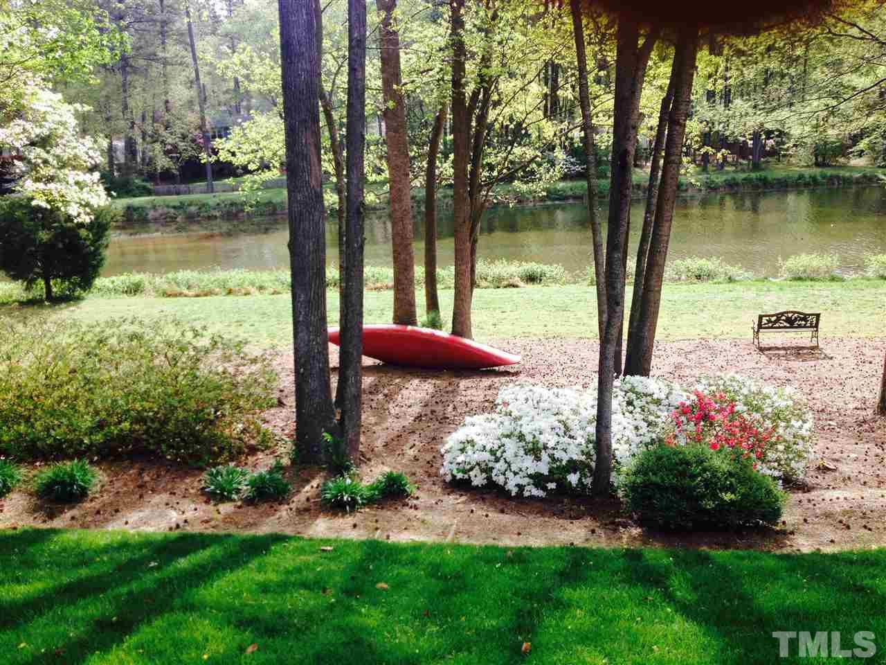 7608 Kelmscot Way Raleigh, NC 27615 - Photo 3 of 23 a view of a garden with a lake view