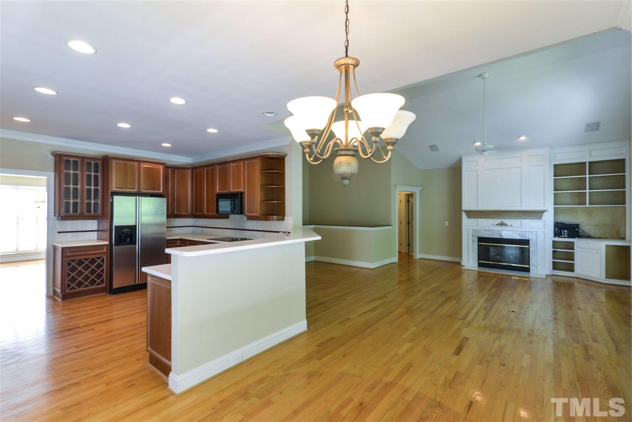 7608 Kelmscot Way Raleigh, NC 27615 - Photo 9 of 23 a view of a kitchen and dining room with wooden floor