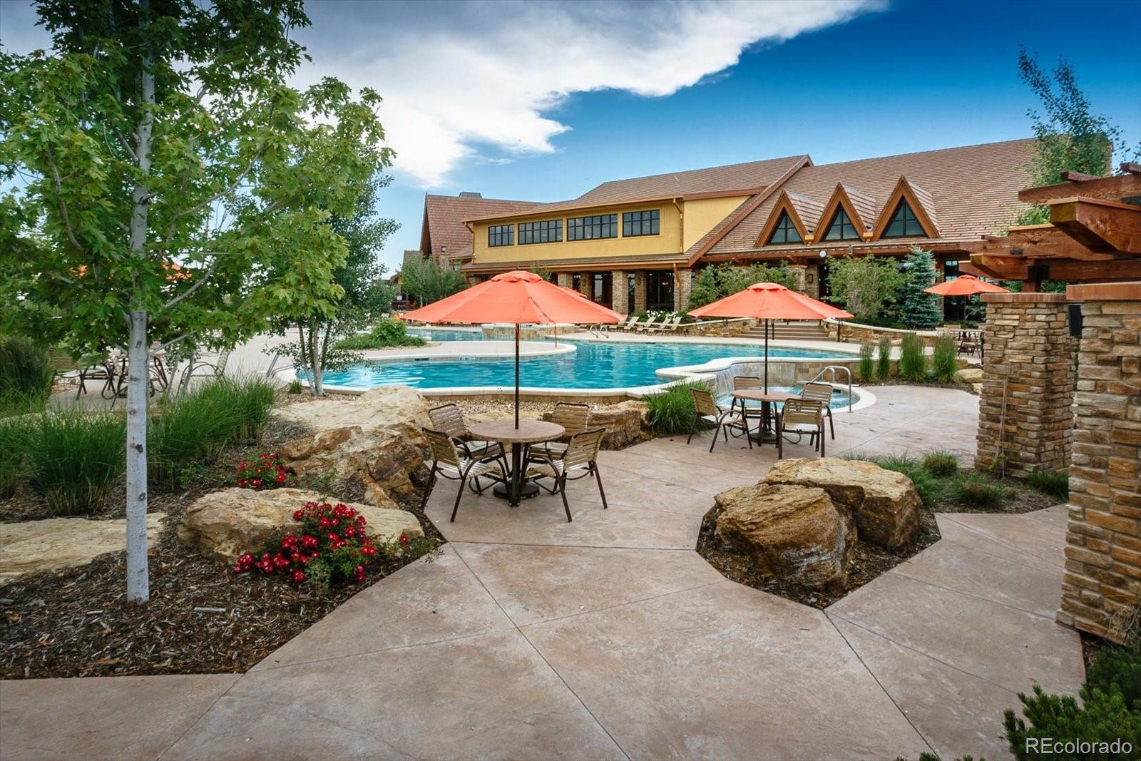 15712 Rito Alto Run Broomfield, CO 80023 - Photo 23 of 26 a view of a patio with a table and chairs under an umbrella