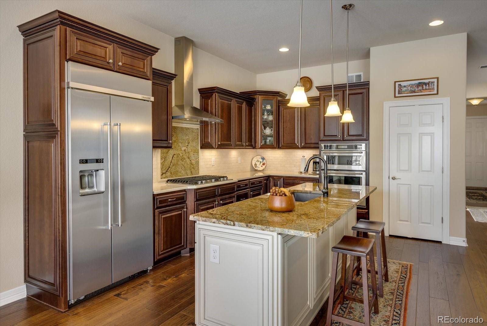 15712 Rito Alto Run Broomfield, CO 80023 - Photo 8 of 26 a kitchen with a refrigerator and a sink