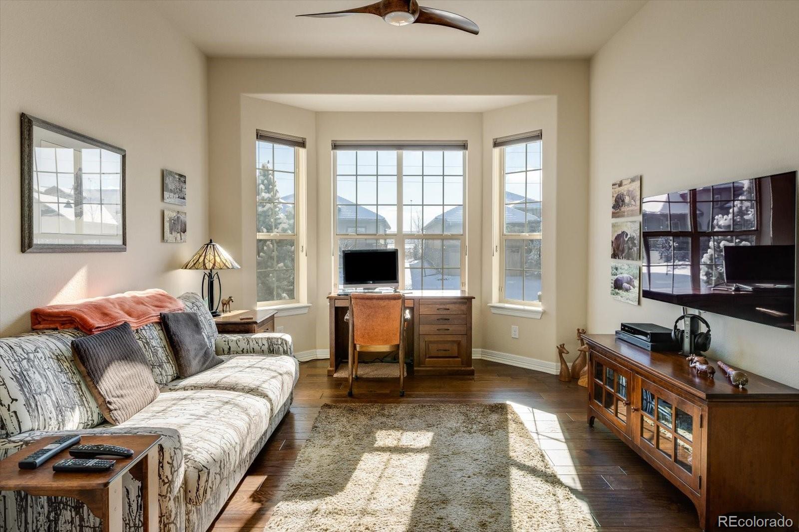 15712 Rito Alto Run Broomfield, CO 80023 - Photo 10 of 26 a living room with furniture and a window