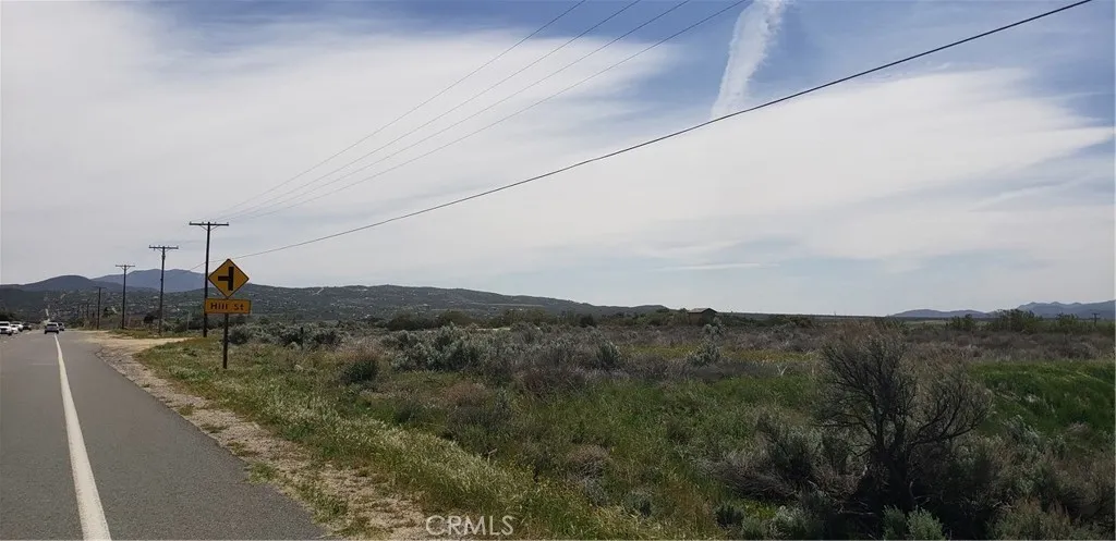 a view of a town with mountains in the background