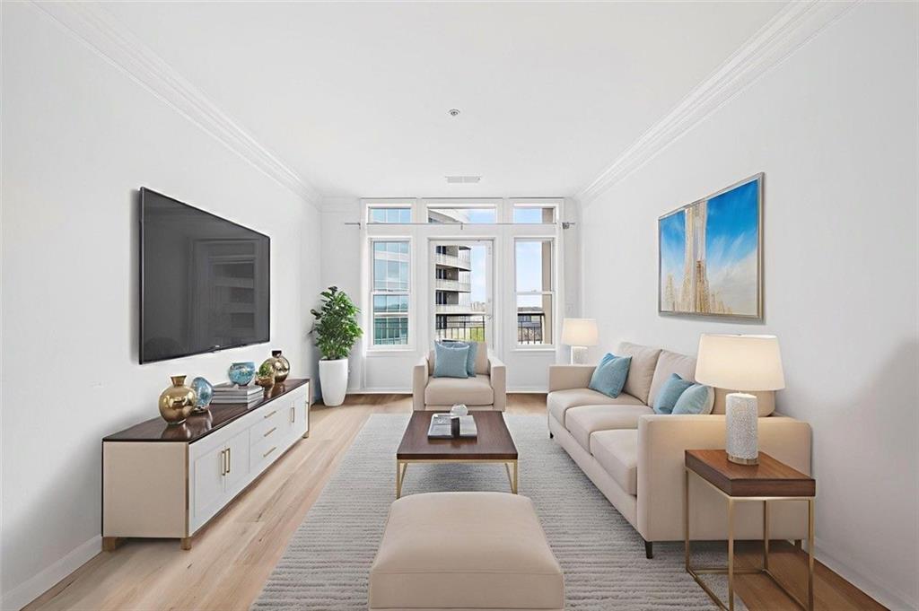 3334 Peachtree Road Northeast, Unit 905 Atlanta, GA 30326 - Photo 1 of 29 a living room with furniture flat screen tv and a couch