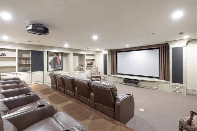 a room with furniture pool table and windows