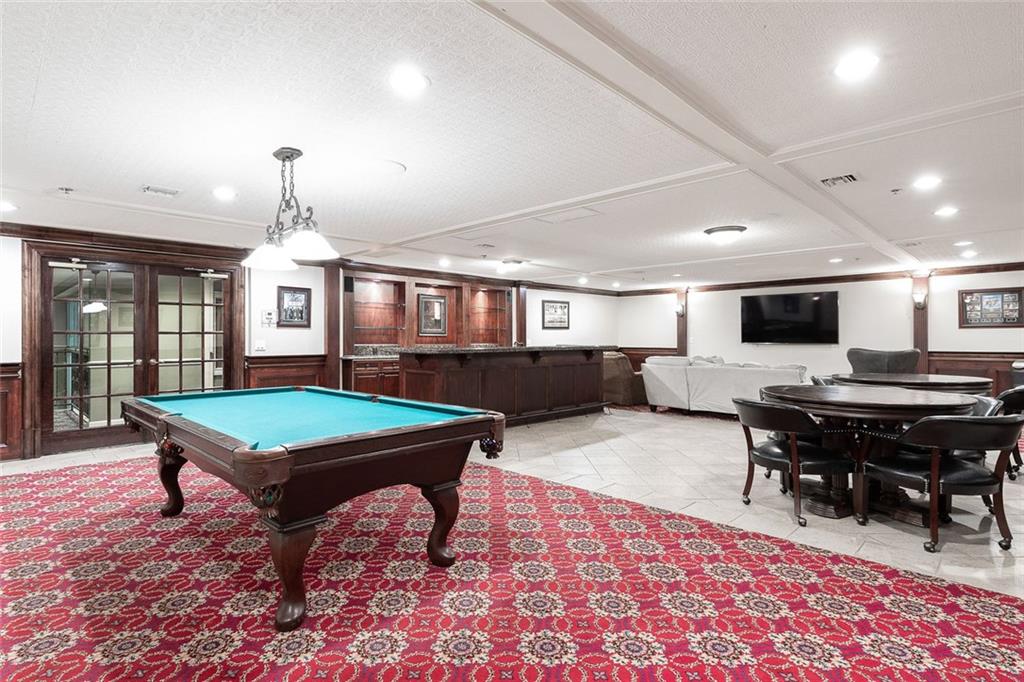 3334 Peachtree Road Northeast, Unit 905 Atlanta, GA 30326 - Photo 25 of 29 a room with furniture pool table and windows
