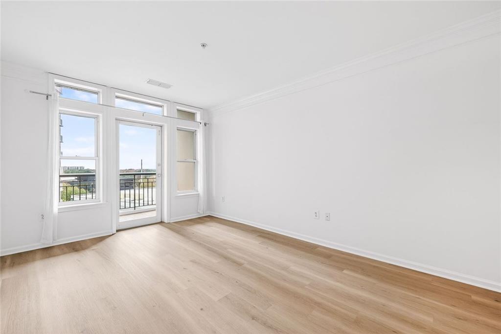 3334 Peachtree Road Northeast, Unit 905 Atlanta, GA 30326 - Photo 3 of 29 a view of an empty room with a window