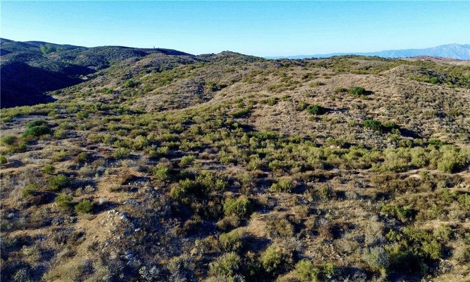 27920 Vista Suelto Road Moreno Valley, CA 92555 - Photo 5 of 16 view of a mountain range with a lush green hillside