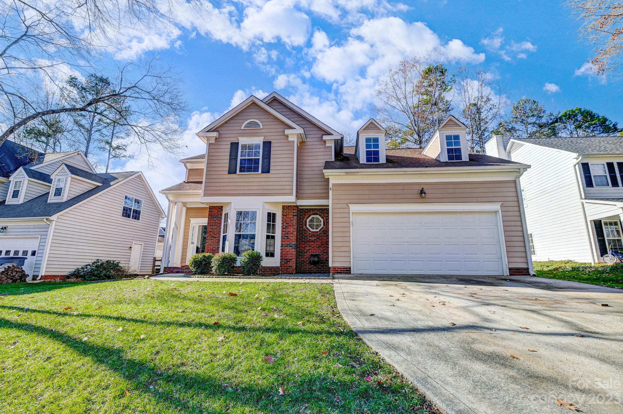 1663 Heather Glen Road Kannapolis, NC 28081 - Photo 1 of 40 a front view of a house with a yard and garage