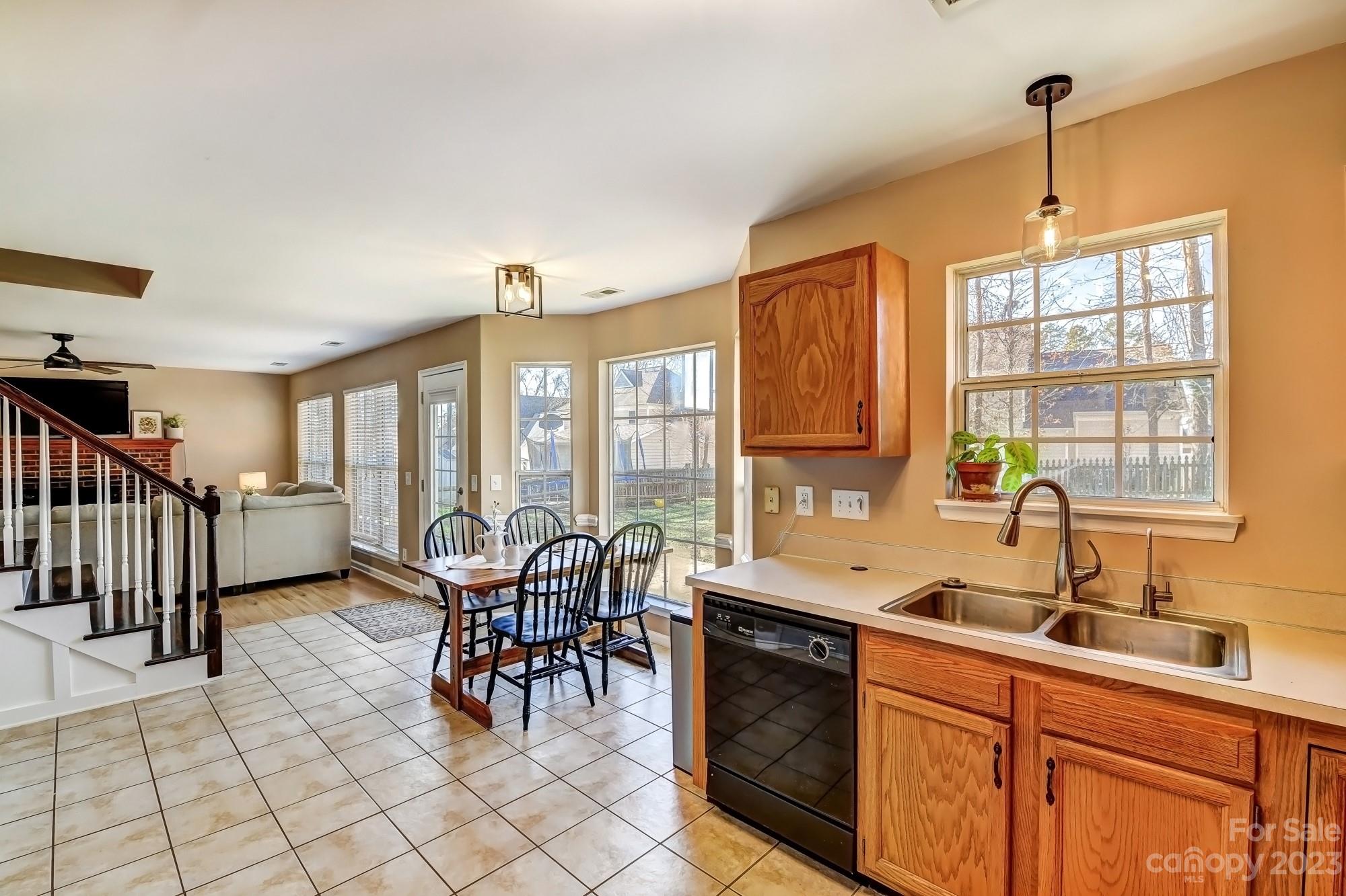 1663 Heather Glen Road Kannapolis, NC 28081 - Photo 13 of 40 a kitchen with stainless steel appliances a sink and cabinets
