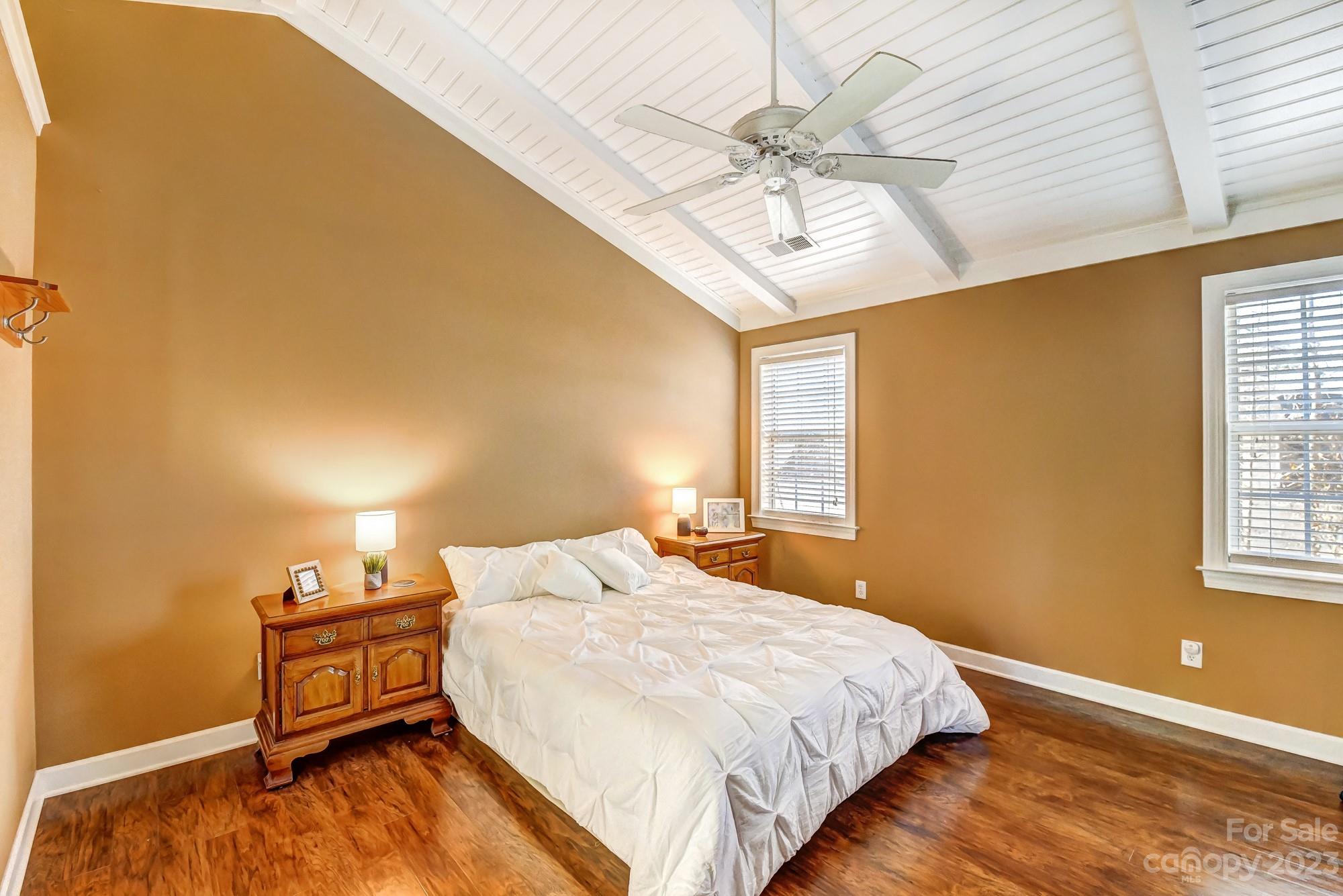 1663 Heather Glen Road Kannapolis, NC 28081 - Photo 19 of 40 a bedroom with a bed and a chandelier