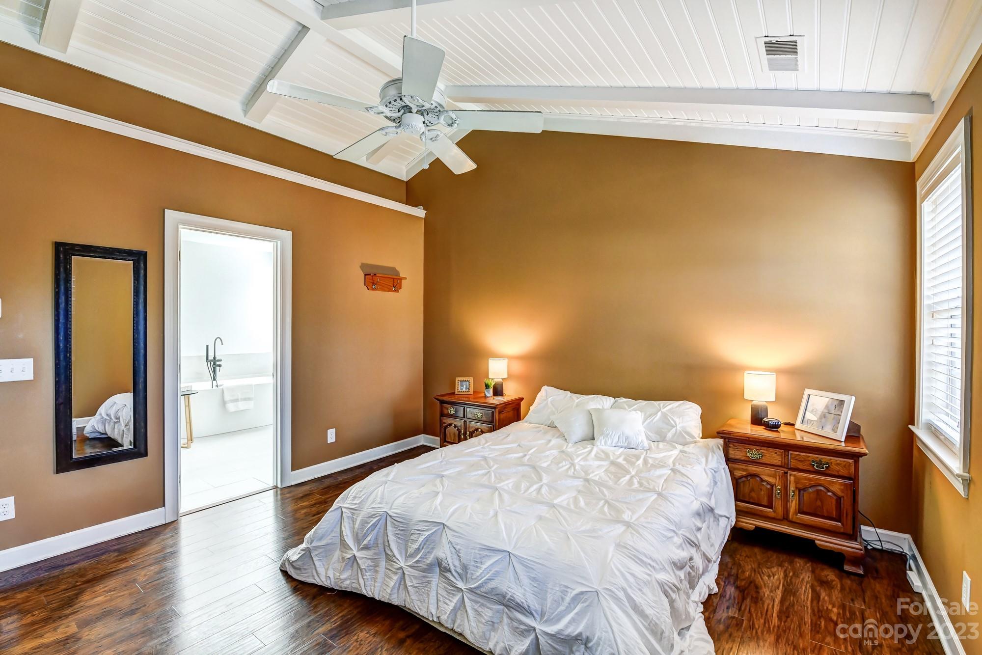 1663 Heather Glen Road Kannapolis, NC 28081 - Photo 20 of 40 a bedroom with a bed and wooden floor