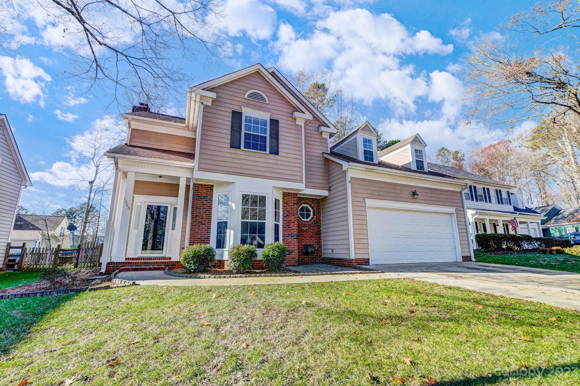 1663 Heather Glen Road Kannapolis, NC 28081 - Photo 2 of 40 a front view of a house with a yard