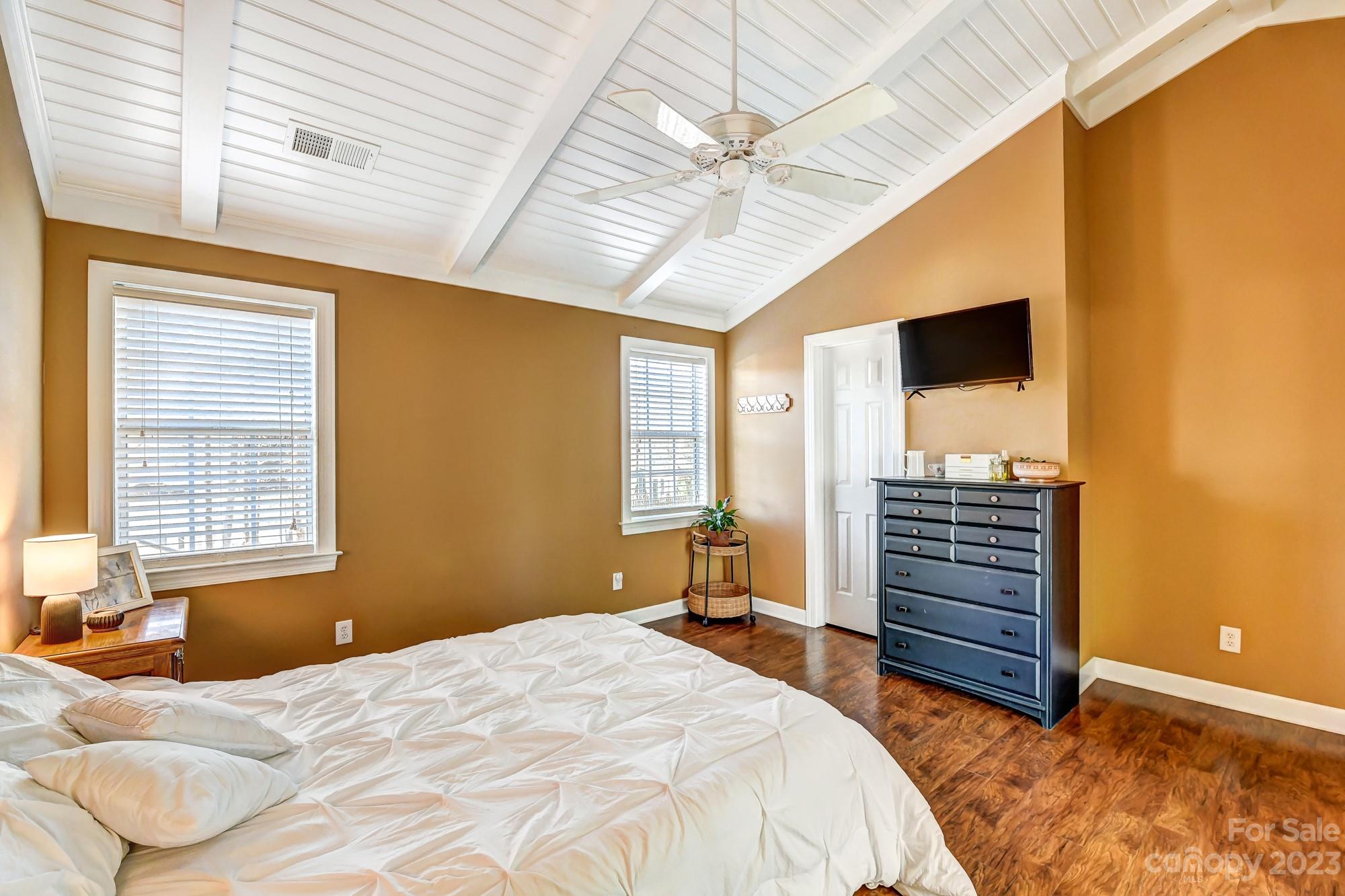 1663 Heather Glen Road Kannapolis, NC 28081 - Photo 21 of 40 a bedroom with a bed and a chandelier