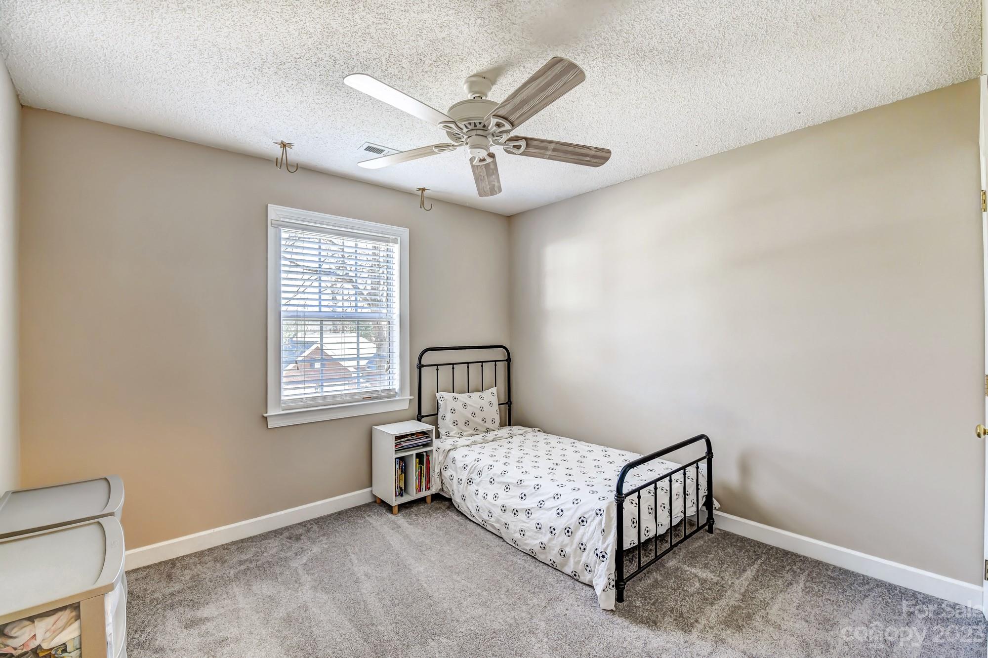 1663 Heather Glen Road Kannapolis, NC 28081 - Photo 24 of 40 a bedroom with a bed and window