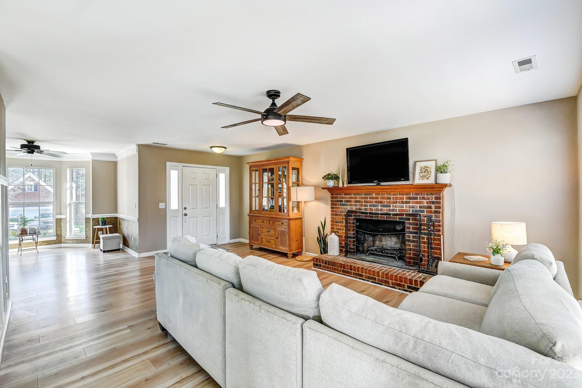 1663 Heather Glen Road Kannapolis, NC 28081 - Photo 6 of 40 a living room with furniture and a fireplace