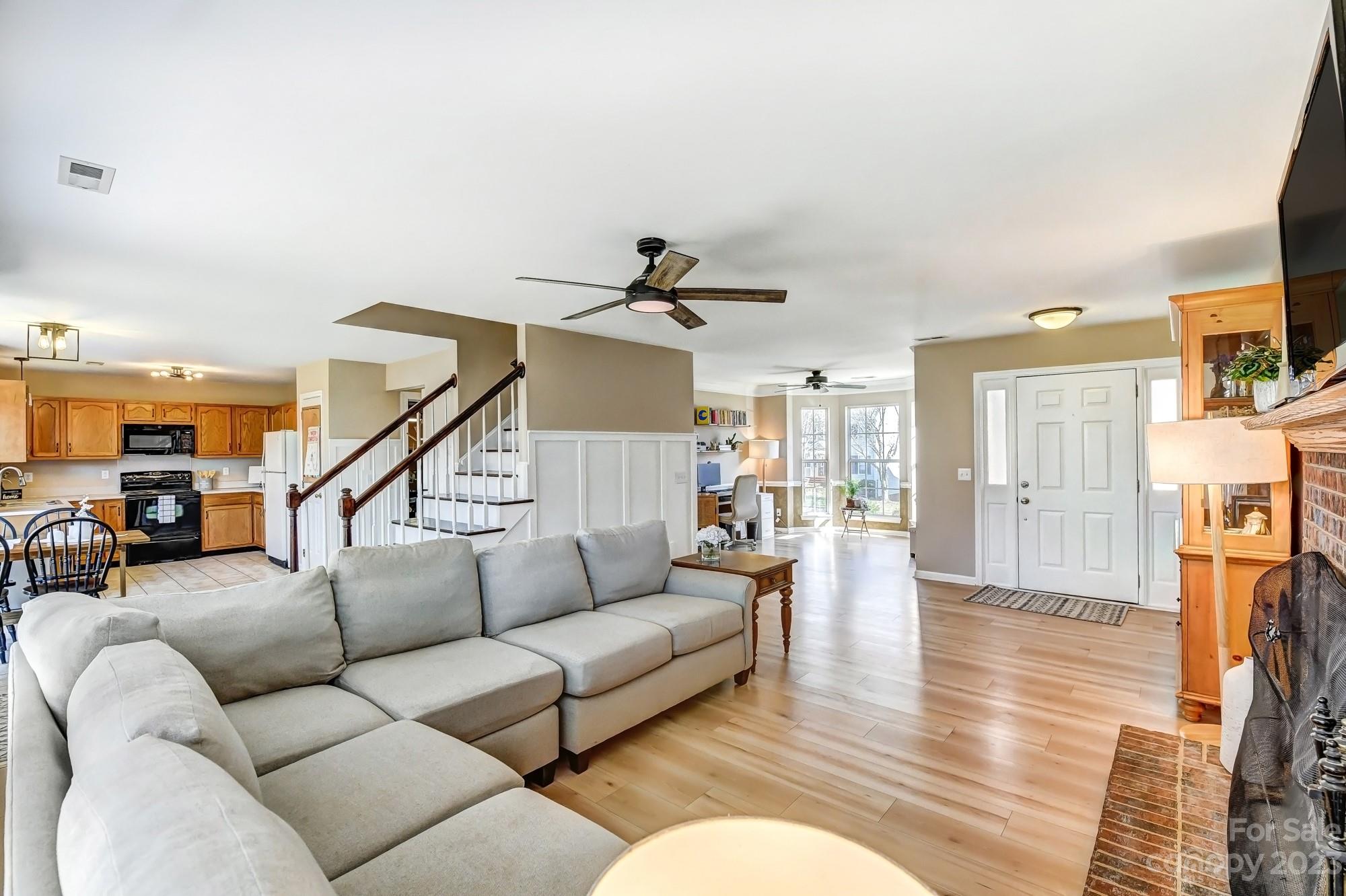 1663 Heather Glen Road Kannapolis, NC 28081 - Photo 7 of 40 a living room with furniture and a chandelier