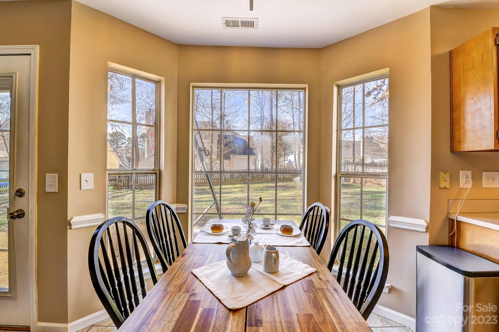 1663 Heather Glen Road Kannapolis, NC 28081 - Photo 9 of 40 a view of a dining room with furniture window and outside view