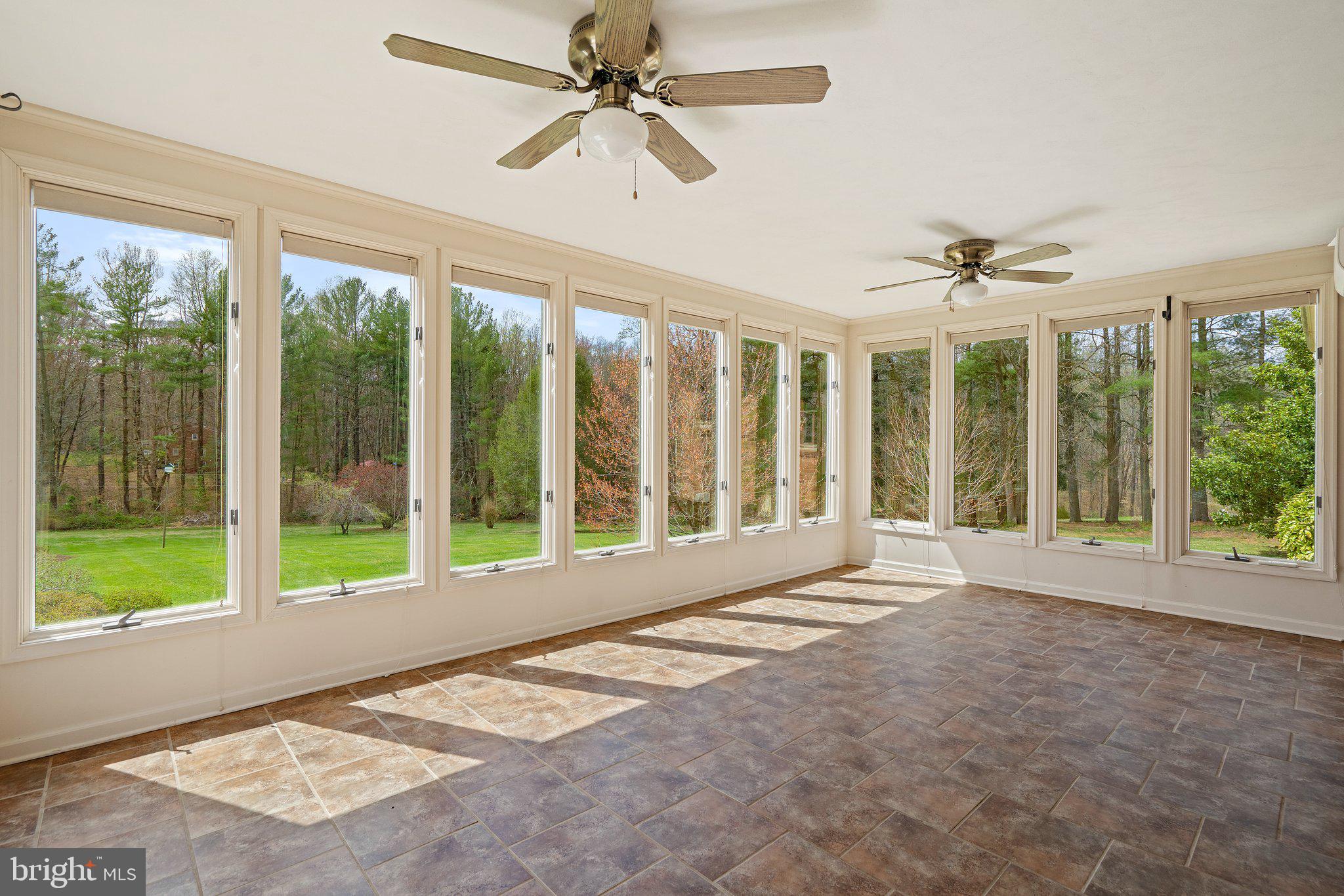 10328 Walker Road Culpeper, VA 22701 - Photo 30 of 79 Tiled sun room, elevated view of sloping backyard
