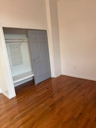 a view of wooden floor and staircase in a room