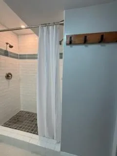 a kitchen with stainless steel appliances a stove a microwave a sink and cabinets