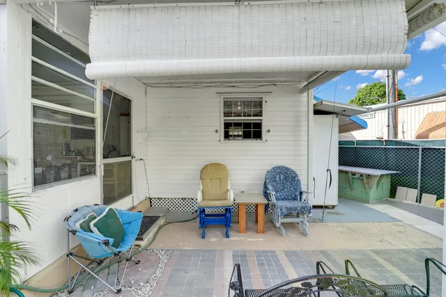 a living room with furniture and a chair