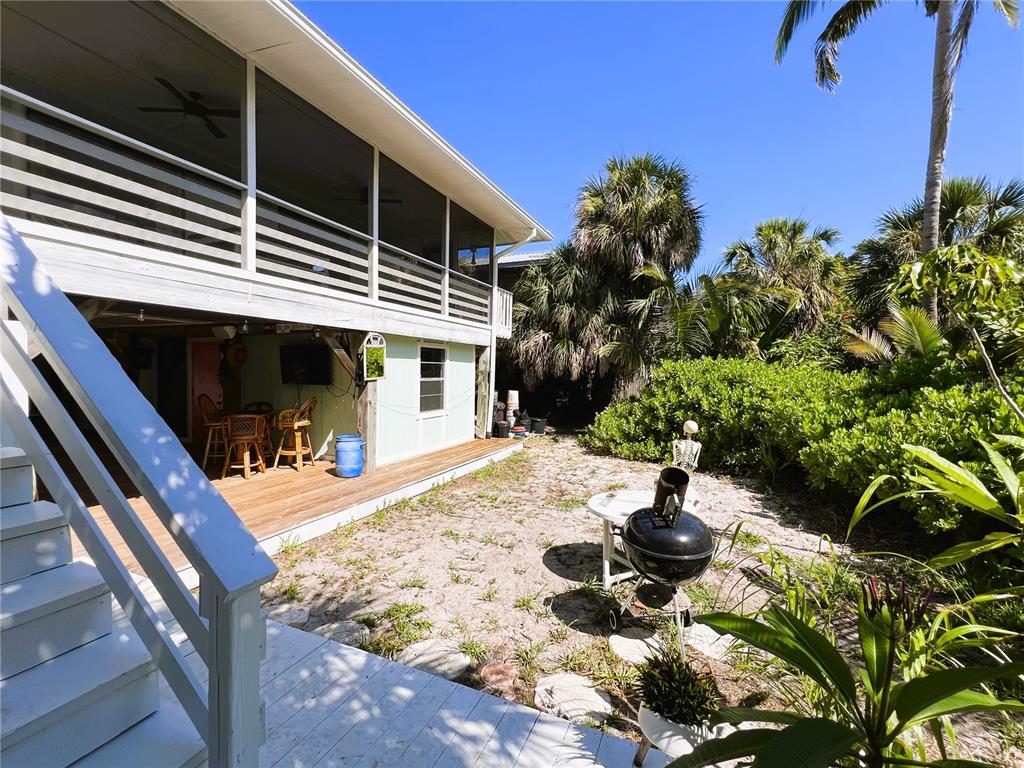 8662 Grand Avenue Boca Grande, FL 33921 - Photo 12 of 63 a view of a backyard with plants and patio
