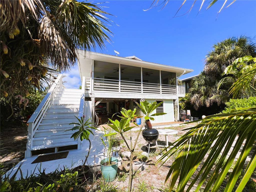 8662 Grand Avenue Boca Grande, FL 33921 - Photo 14 of 63 a view of a backyard with plants and chairs