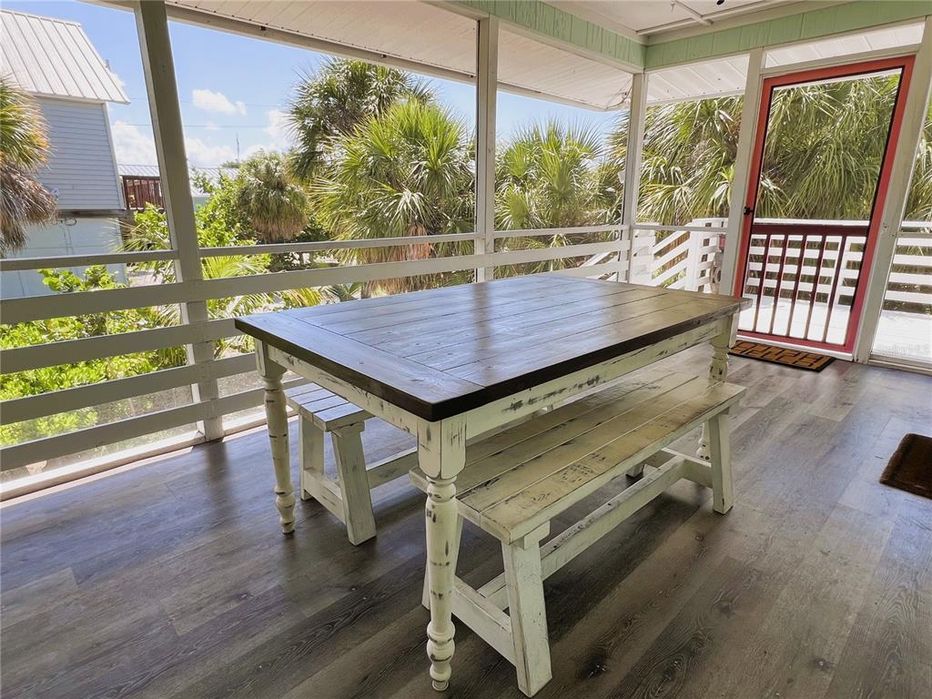 8662 Grand Avenue Boca Grande, FL 33921 - Photo 26 of 63 a view of a chairs and table in the patio