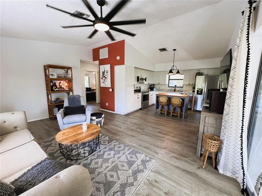 8662 Grand Avenue Boca Grande, FL 33921 - Photo 27 of 63 a living room with furniture and a wooden floor