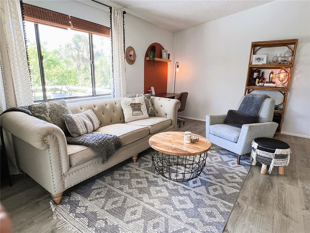 8662 Grand Avenue Boca Grande, FL 33921 - Photo 33 of 68 a living room with furniture and a large window