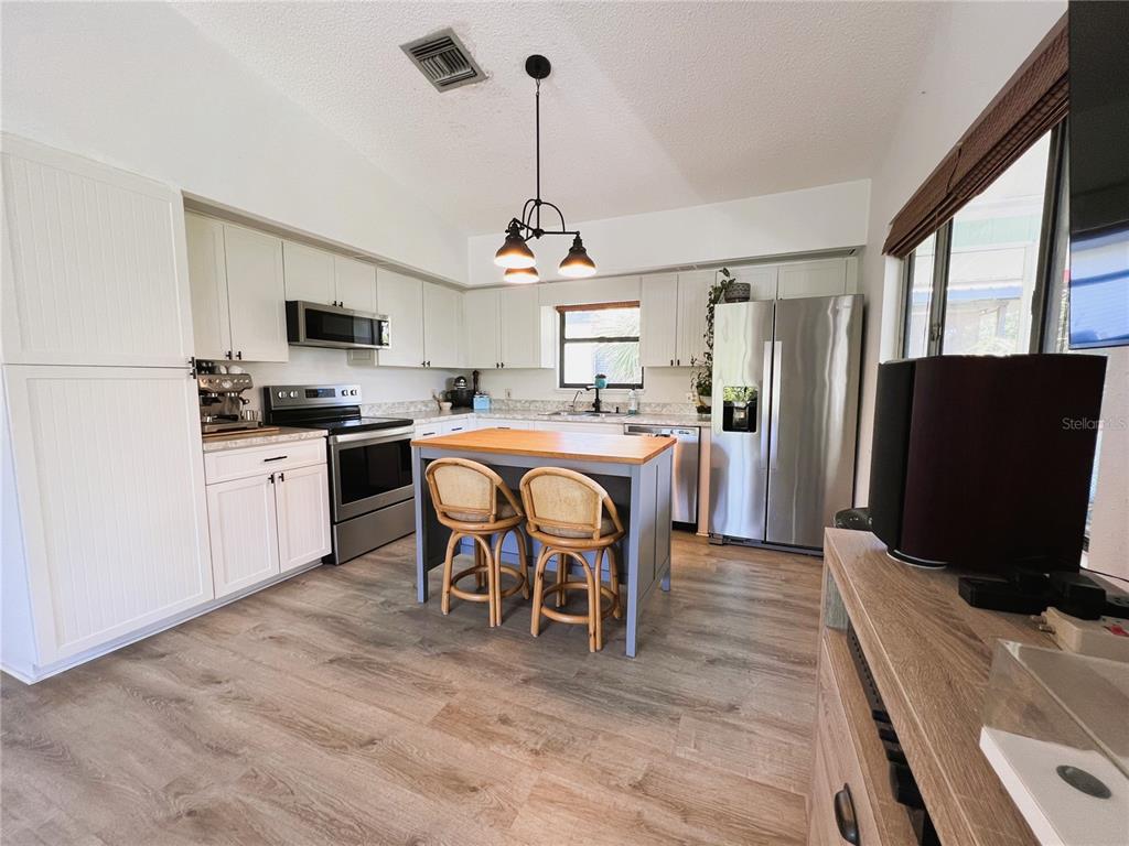 8662 Grand Avenue Boca Grande, FL 33921 - Photo 34 of 68 a view of a dining room with furniture window and wooden floor