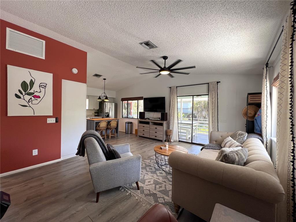 8662 Grand Avenue Boca Grande, FL 33921 - Photo 41 of 68 a living room with furniture and a flat screen tv