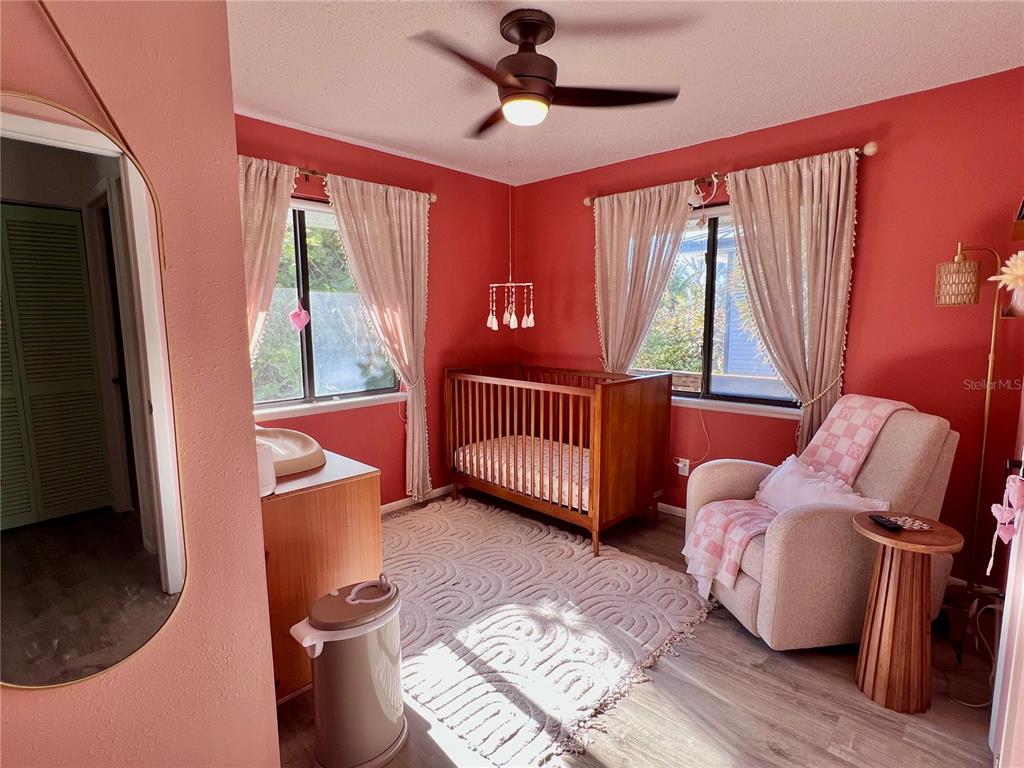 8662 Grand Avenue Boca Grande, FL 33921 - Photo 46 of 63 a bedroom with furniture and a window