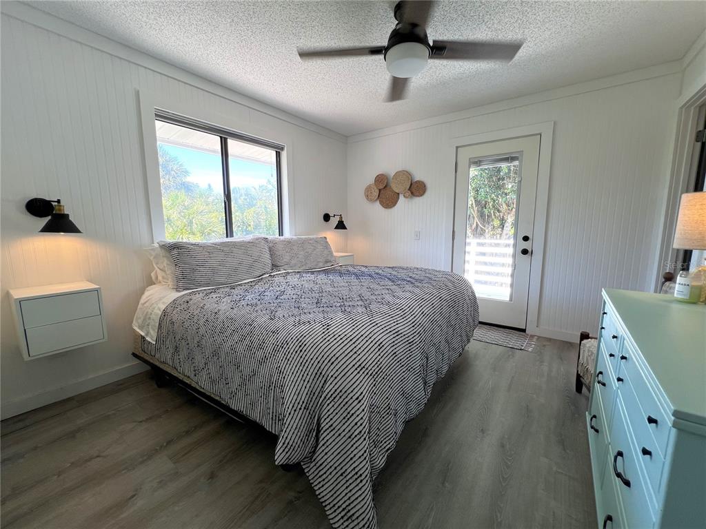 8662 Grand Avenue Boca Grande, FL 33921 - Photo 48 of 68 a bedroom with a bed and a dresser