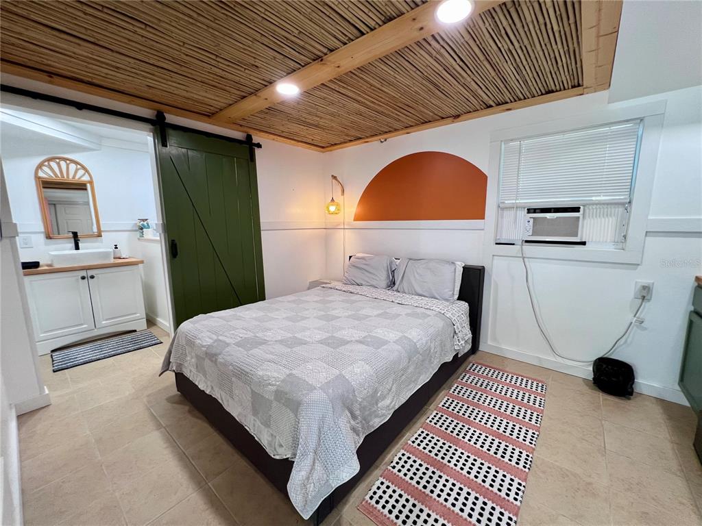 8662 Grand Avenue Boca Grande, FL 33921 - Photo 50 of 63 a bedroom with a bed and a dresser