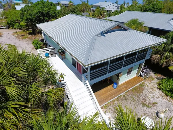 an aerial view of a house with river lake view and mountain view