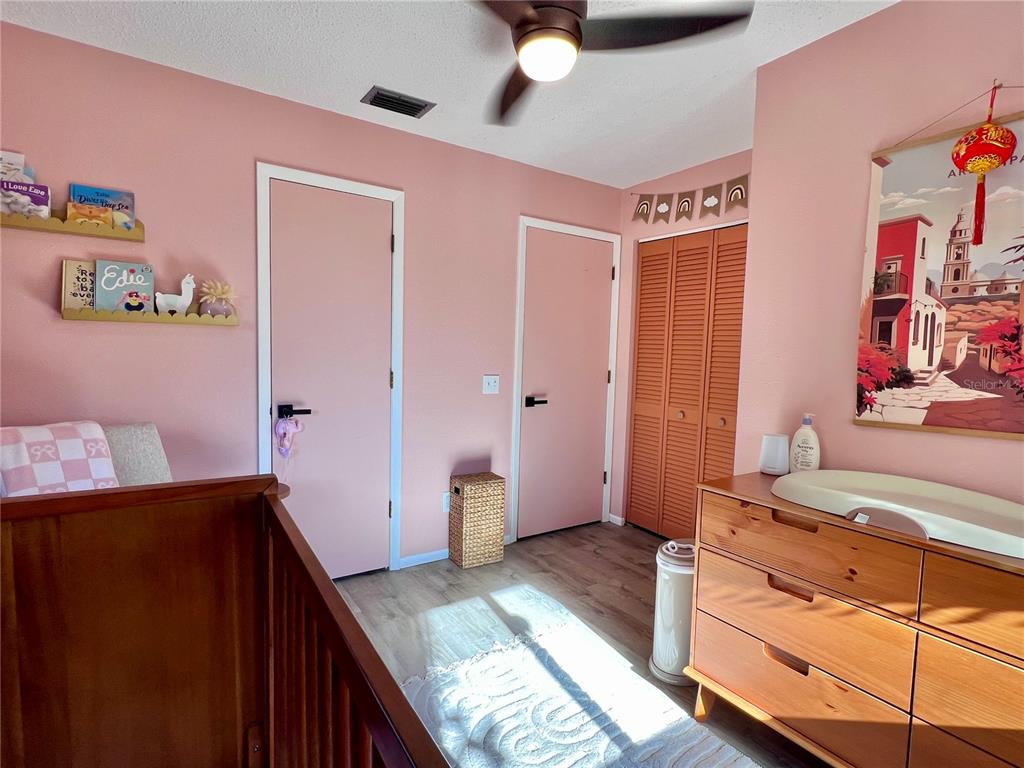 8662 Grand Avenue Boca Grande, FL 33921 - Photo 53 of 68 a bedroom with a bed and a dresser