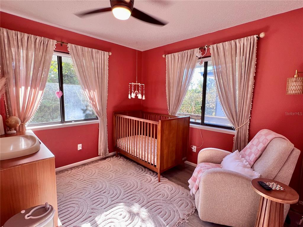 8662 Grand Avenue Boca Grande, FL 33921 - Photo 54 of 68 a bedroom with a bed and a window