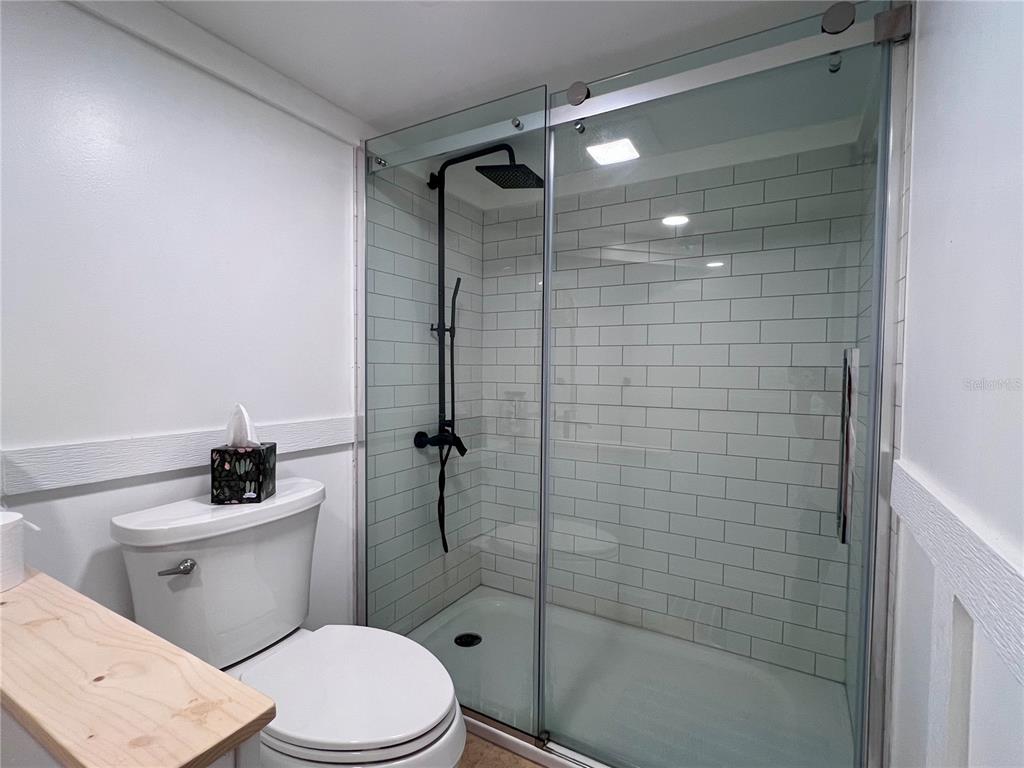 8662 Grand Avenue Boca Grande, FL 33921 - Photo 56 of 68 a bathroom with a toilet and a shower
