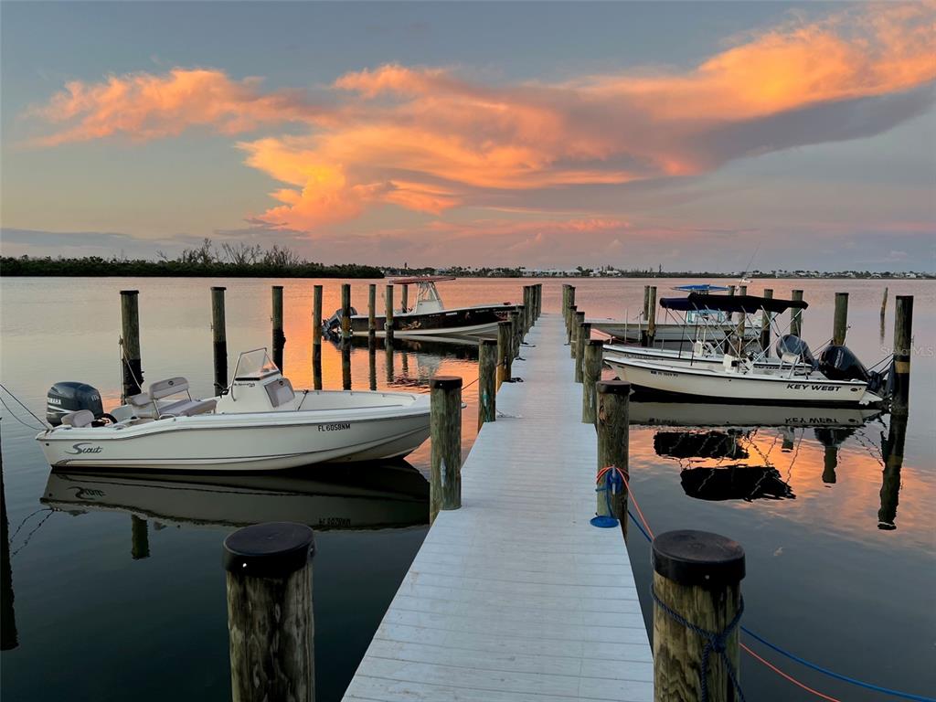 8662 Grand Avenue Boca Grande, FL 33921 - Photo 57 of 63 a balcony with table and chairs