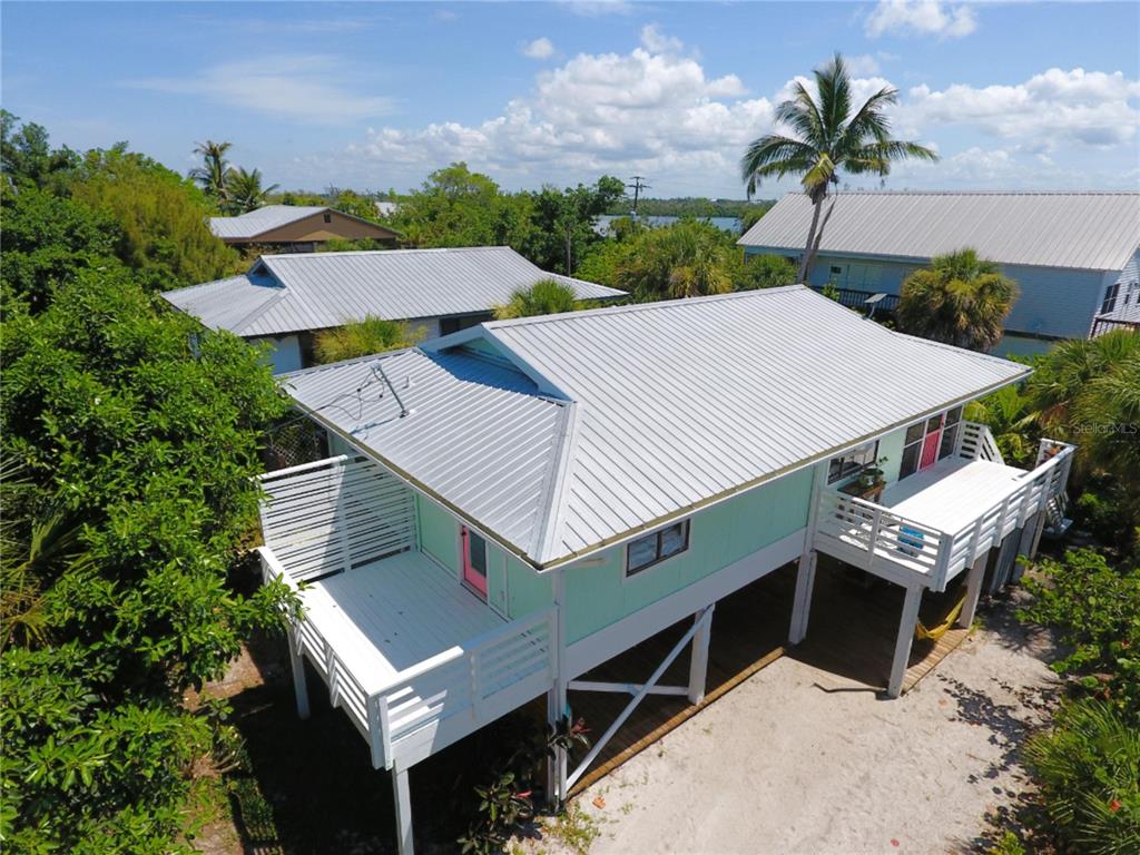 8662 Grand Avenue Boca Grande, FL 33921 - Photo 7 of 63 an aerial view of a house with balcony and outdoor space