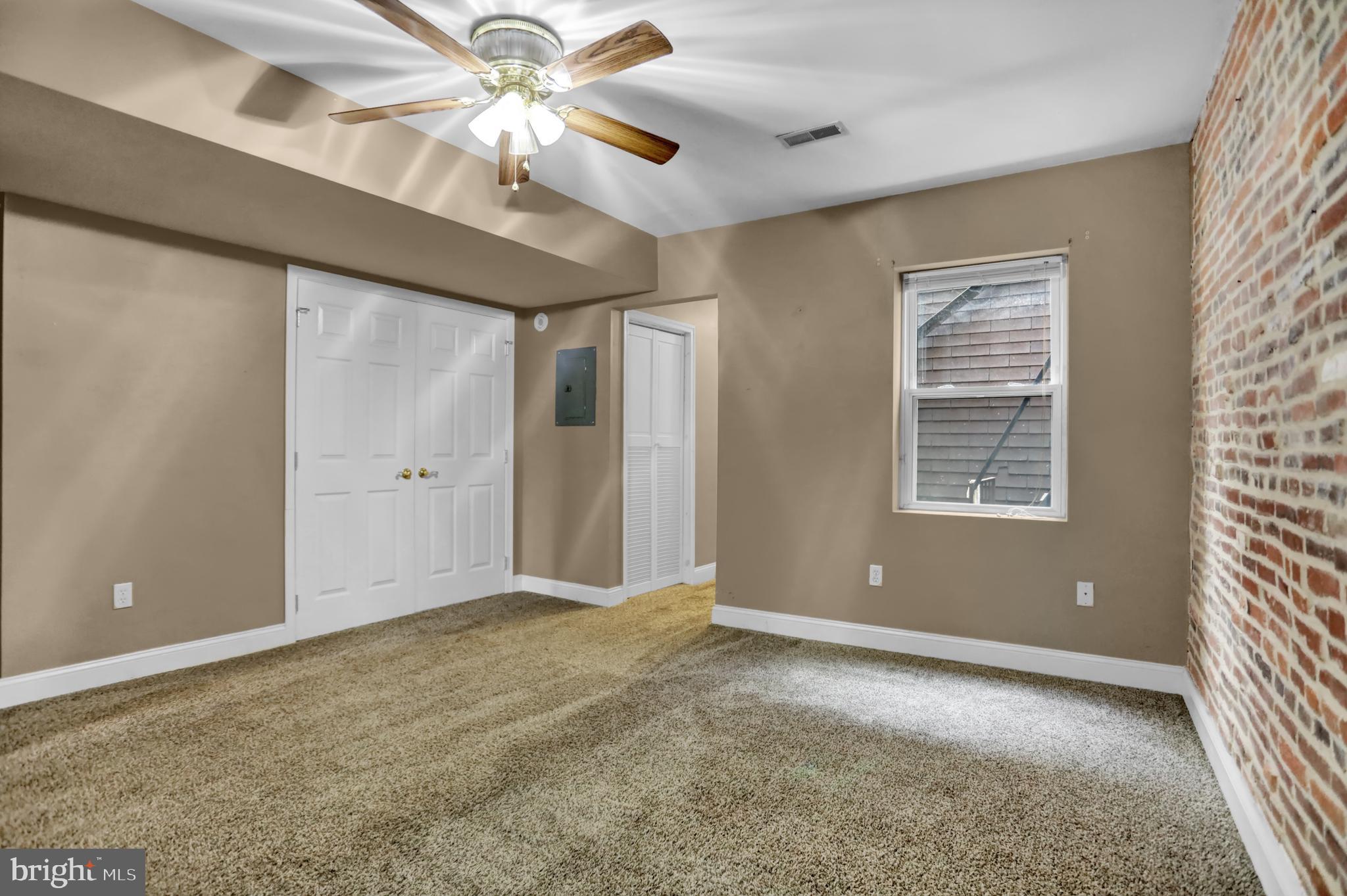 1103 Light Street, Unit A Baltimore, MD 21230 - Photo 13 of 23 a view of an empty room with a window