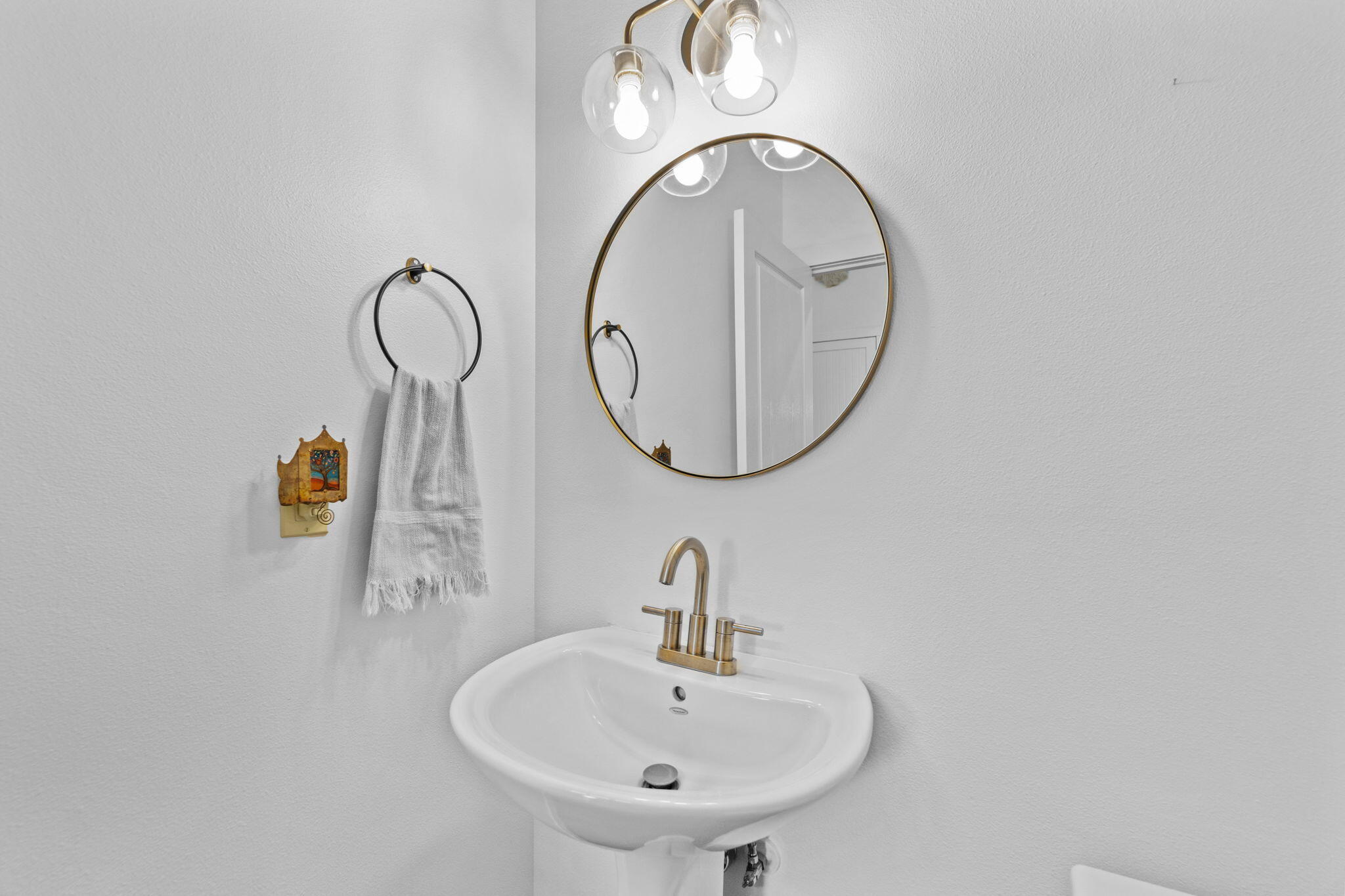 10942 Village Loop Redmond, OR 97756 - Photo 34 of 45 a bathroom with a sink and a mirror