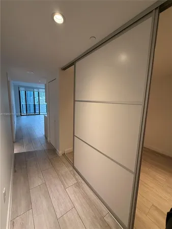 a view of a hallway with closet