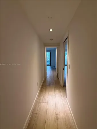 a view of entryway with wooden floor