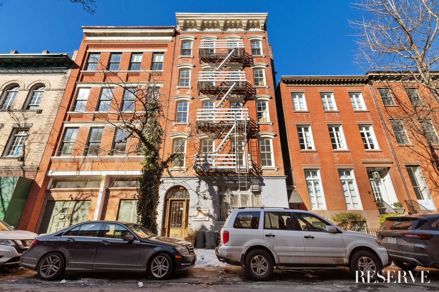 29 Perry Street, Unit 5R Manhattan, NY 10014 - Photo 13 of 14 a car parked in front of a building