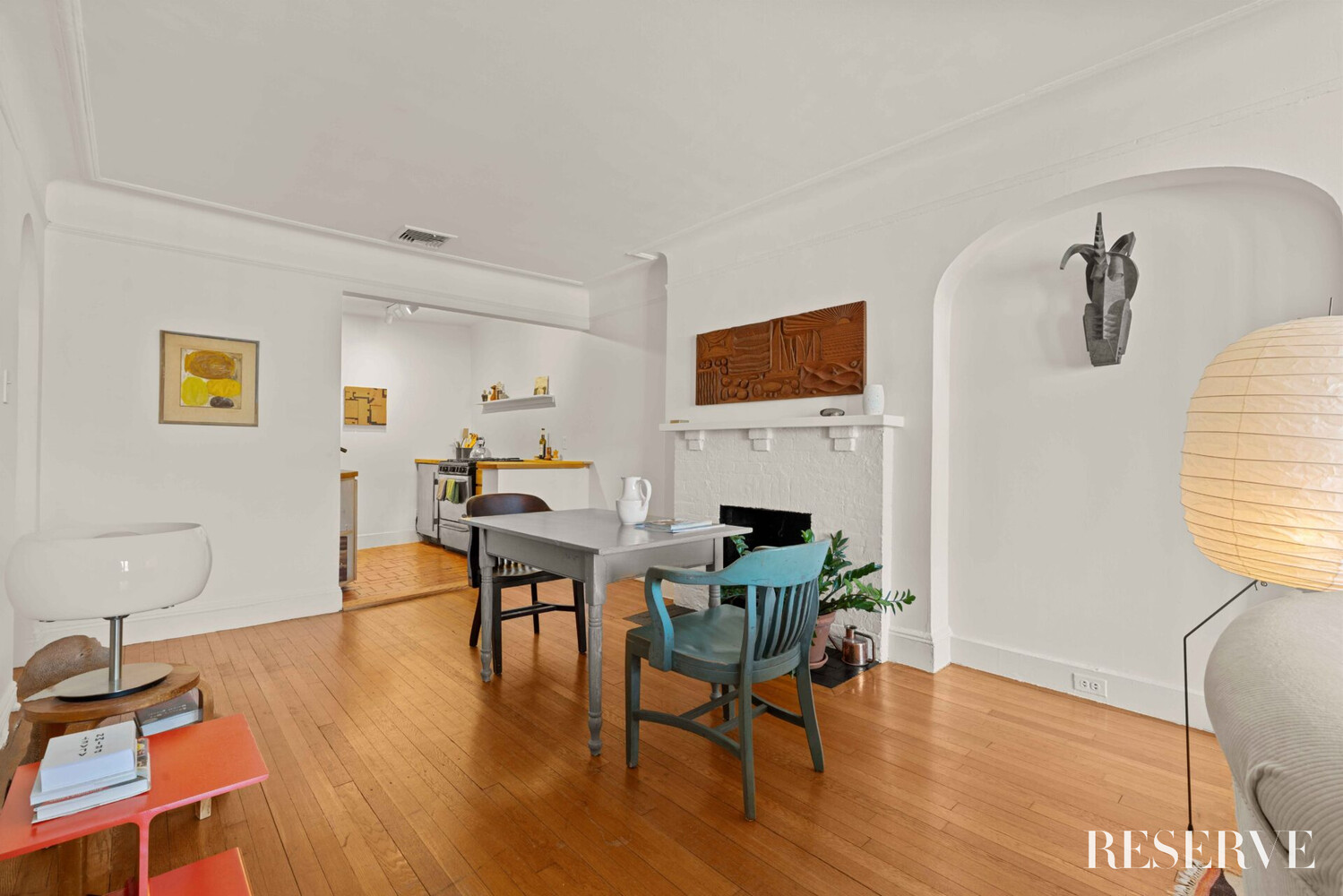 29 Perry Street, Unit 5R Manhattan, NY 10014 - Photo 5 of 14 a living room with furniture a fireplace and a flat screen tv