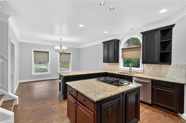 a kitchen with a stove and a sink
