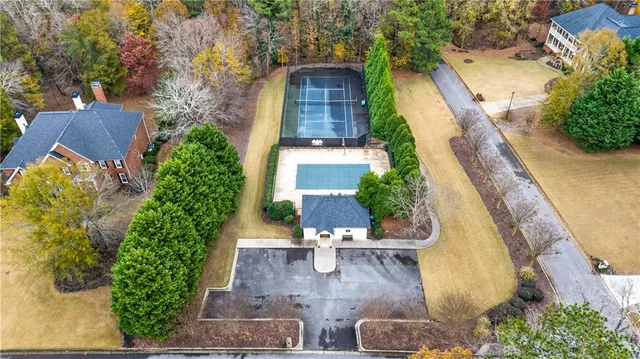 an aerial view of residential houses with outdoor space